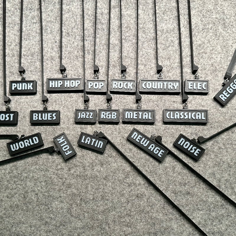 3D-printed music genre shelf tags in black with white letters
