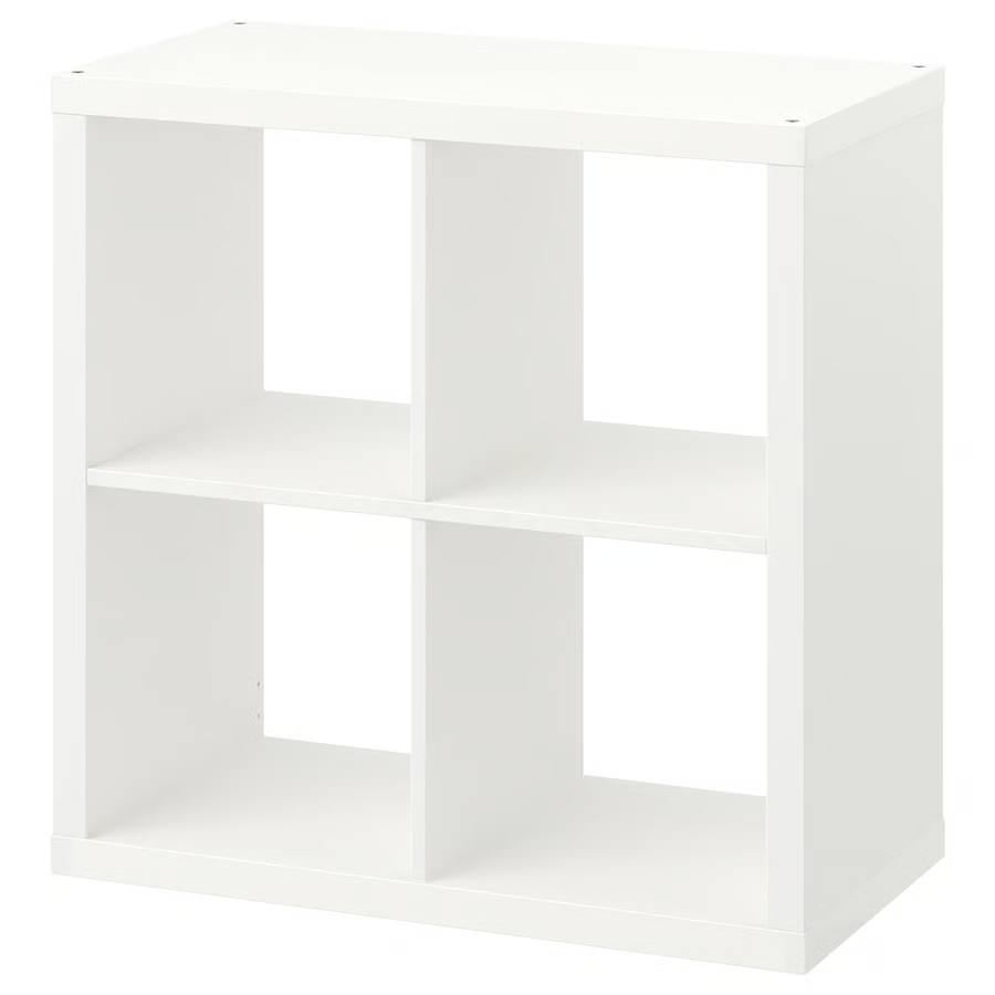 A white Ikea Kallax shelf with 4 storage spaces.