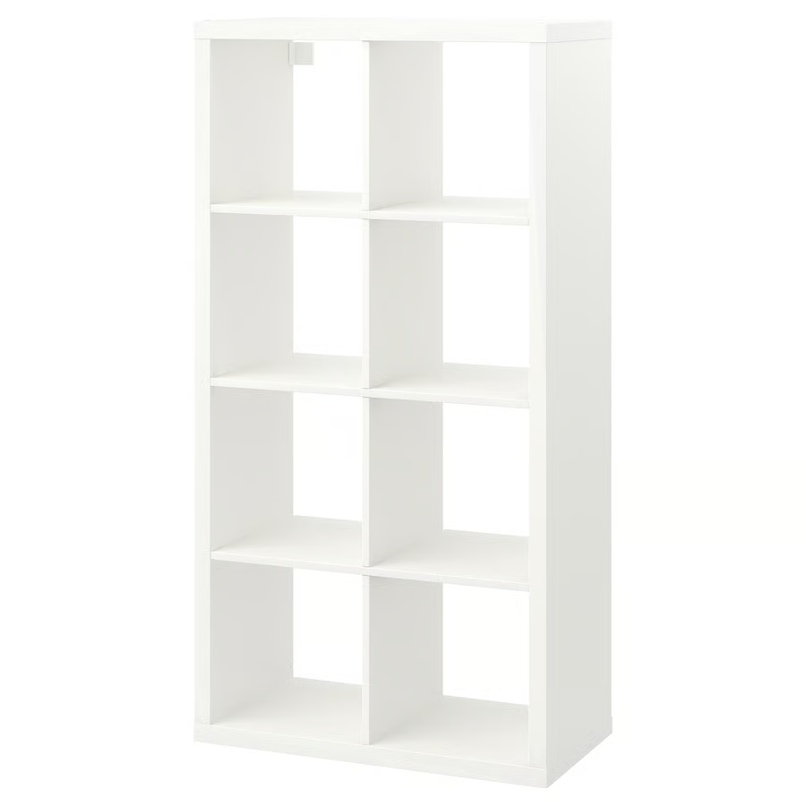 A white Ikea Kallax shelf with 8 storage spaces.